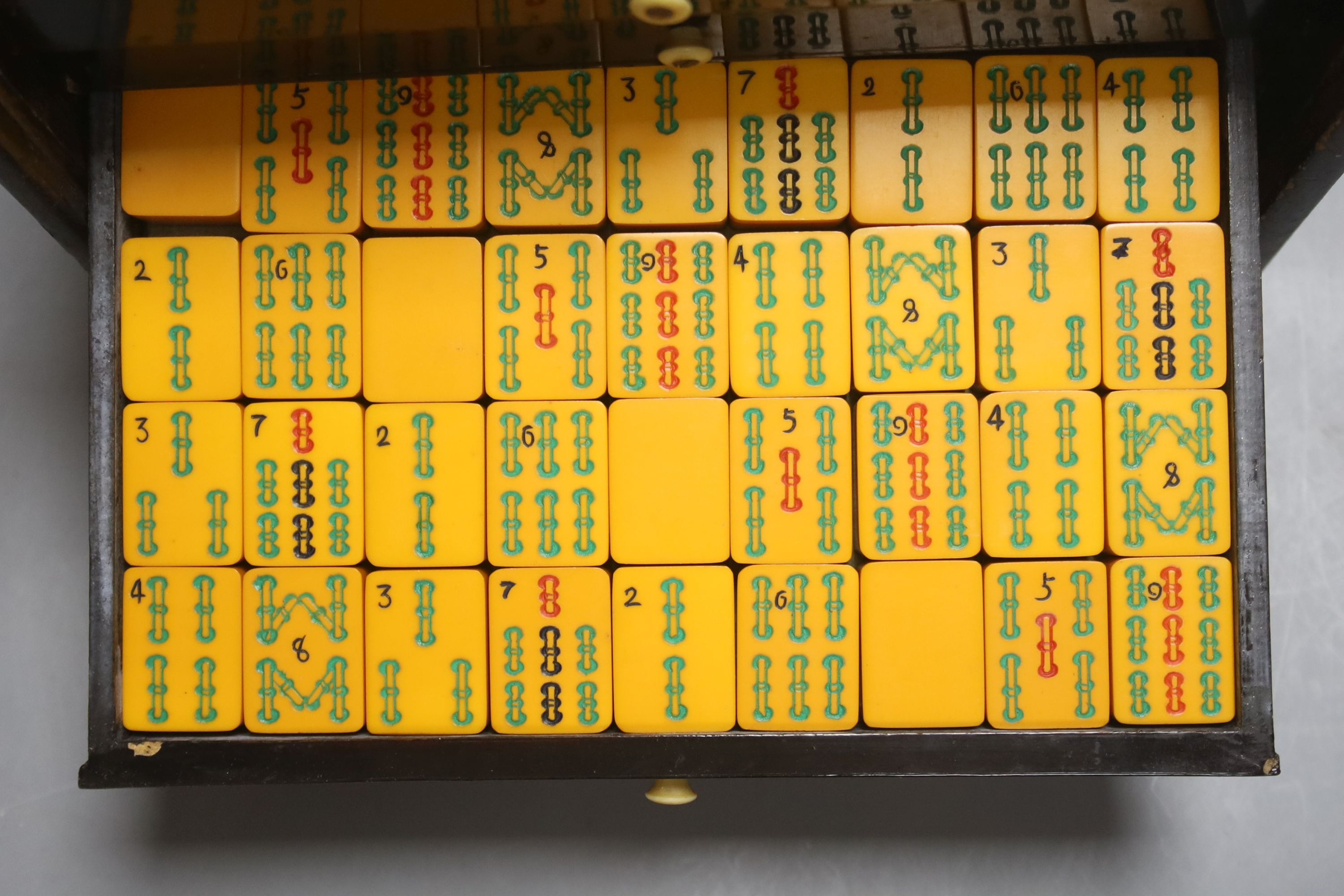 A Chinese lacquer cased Mah Jong set